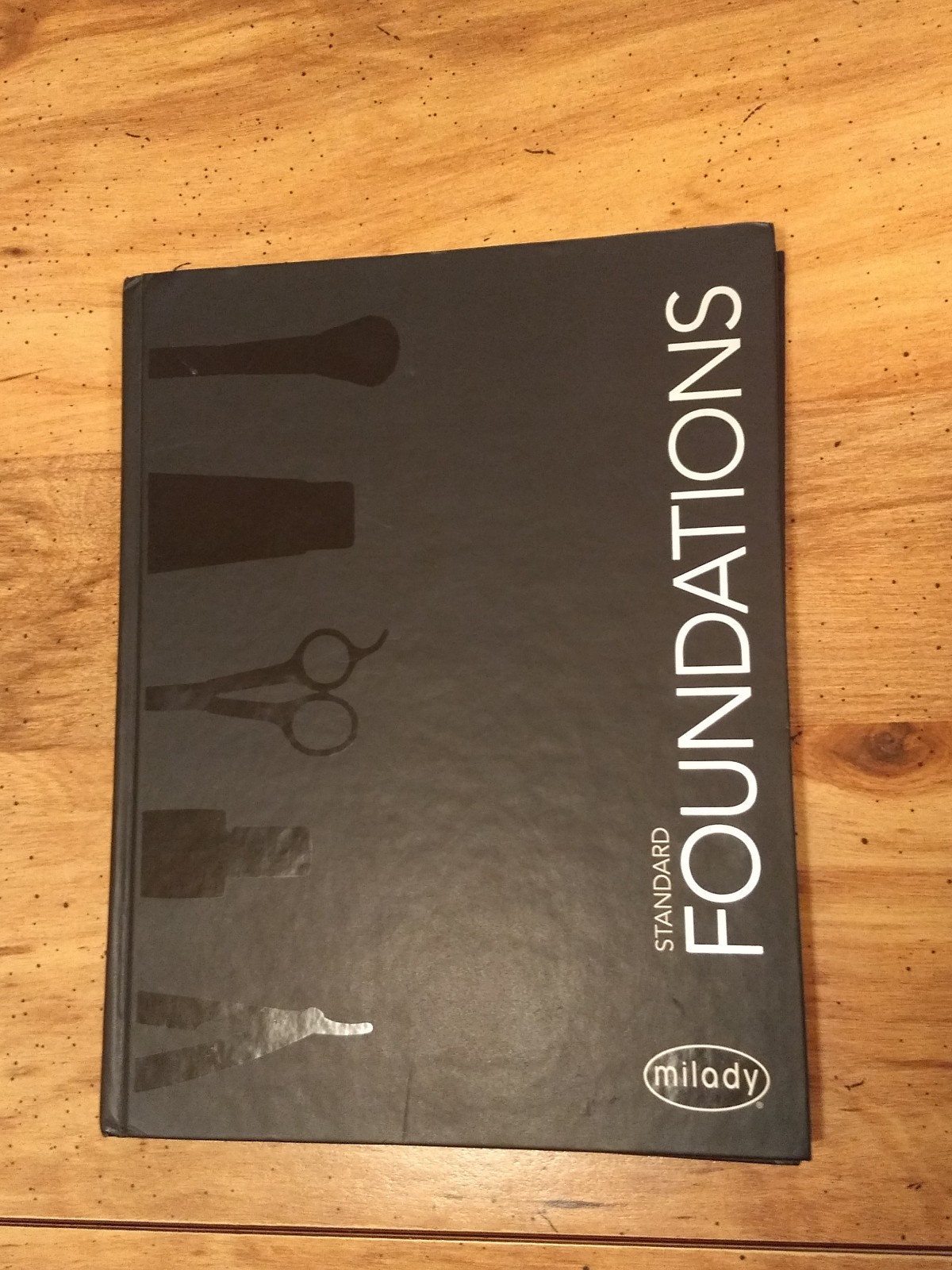Milady Standard Foundations by Milady Cengage Learning Hardcover text book