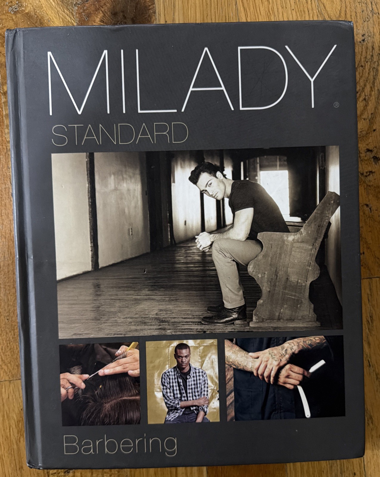 Milady Standard Barbering Hardcover Textbook. Used Good Condition.